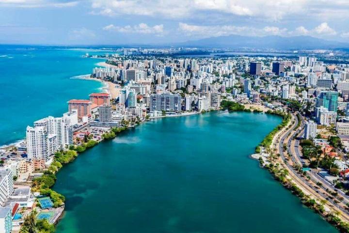 a large body of water with a city in the background