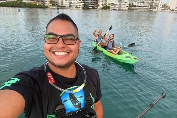 a man rowing a boat in a body of water